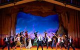 The company of The Book of Mormon on stage