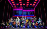 Layton Williams as Jamie leads full cast in a song - all seen clapping to the music and connecting with the audience