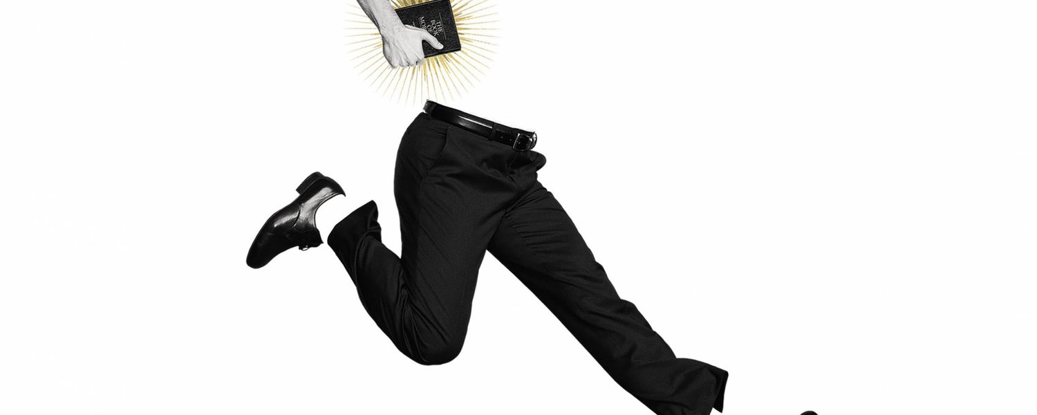 Man jumping for joy holding bible