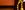 Theatre Royal Newcastle A red velvet curtain tied back with a yellow curtain tie