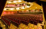 Rows of empty auditorium seats