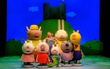 Peppa Pig and her friends outside a castle