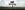 Animal Farm A metal sign post with proud looking pig standing on top looking off into the distance