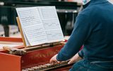 A man sits at a piano