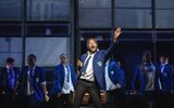 Students in school uniform dancing.