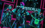 Three people dressed in futuristic black leather and neon outfits.