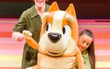 A cartoon dog looks excitedly out towards the audience