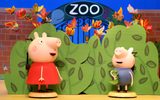 Peppa and George stand outside of the zoo.