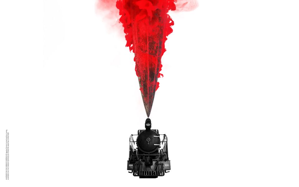 An image of a black train with red smoke above it. The background is bright white.