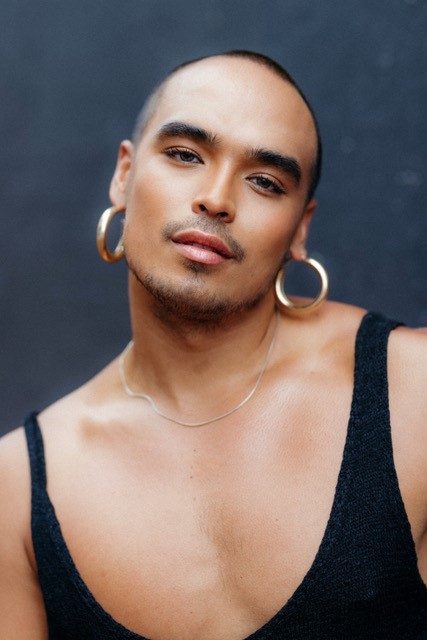 Seann Miley Moore Picture shows Seann Miley Moore, a dark skinned and dark haired man with earrings, who will play he Engineer in the brand new production of Miss Saigon